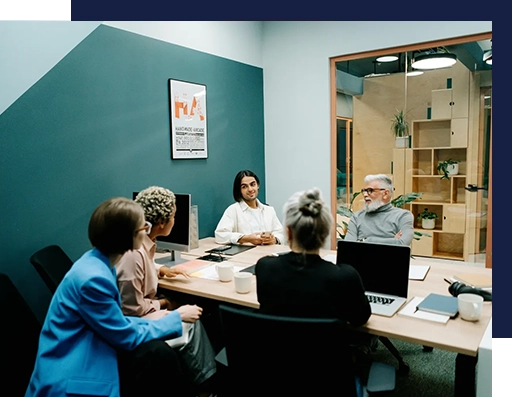 A group of people sitting around a table.